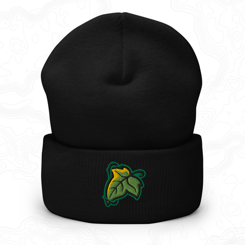 Black Elven Brooch cuffed beanie with a green and gold leaf embroidered on the front.